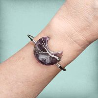 Wire-Wrapped Amethyst Moon Bracelet, displaying the captivating gemstone crescent and intricate wire-wrapped tree design.