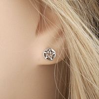 Closeup of a Silver Pentacle Post Earring in a model's ear, showing that it is designed for comfort and subtle style.