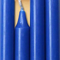 Closeup of a quartet of royal blue chime candles arranged side-by-side so they form an almost solid block of color.