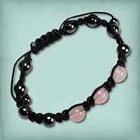 Rose Quartz Shamballa Bracelet showing metallic grey hematite beads and soft pink rose quartz beads on a black cord.