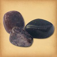 Three tumbled Lepidolite stones, ranging from muted purple to quite dark, demonstrating the typical variety in a set.