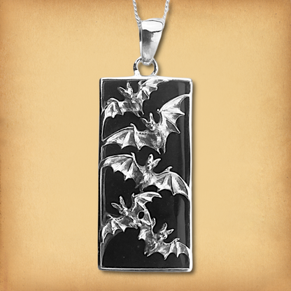 Silver Bat Flight Pendant with Lava Stone