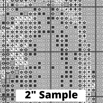 Part of the printed cross stitch chart, showing 2” section of the gridded pattern, with black/white symbols for each stitch.