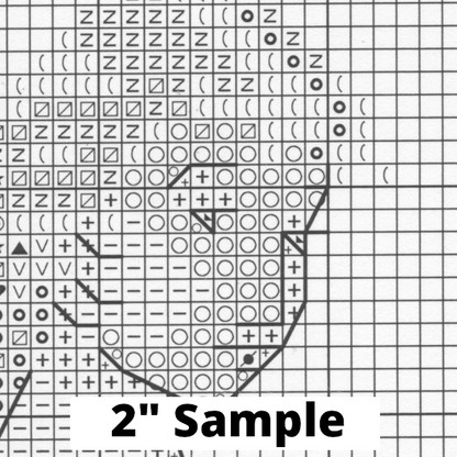 Part of the printed cross stitch chart, showing 2” section of the gridded pattern, with black/white symbols for each stitch.